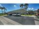 Community carport featuring assigned covered parking spaces for residents and guests at 1310 Grand Blvd # 202, Sarasota, FL 34232