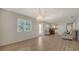 Bright living room showcasing wood-look floors, a charming light fixture, and an open layout at 1310 Grand Blvd # 202, Sarasota, FL 34232