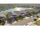 A picturesque view of the homes next to a large lake in the neighborhood with plenty of beautiful greenery at 14238 59Th E Cir, Bradenton, FL 34211