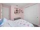 Charming bedroom featuring flamingo bedding, closet, and personal touches creating a cozy and inviting space at 14238 59Th E Cir, Bradenton, FL 34211