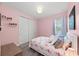 Bedroom with flamingo-themed decor and bright lighting at 14238 59Th E Cir, Bradenton, FL 34211