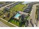 Aerial view of community pool surrounded by lush landscaping and neighborhood homes at 14238 59Th E Cir, Bradenton, FL 34211