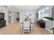 Comfortable dining area with a wooden table, chairs, unique wallpaper, and easy access to other living spaces at 14238 59Th E Cir, Bradenton, FL 34211