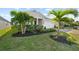Charming single-story home with a well-manicured lawn, brick driveway, and attached two-car garage at 14238 59Th E Cir, Bradenton, FL 34211