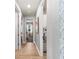 Hallway featuring a view into laundry room at 14238 59Th E Cir, Bradenton, FL 34211