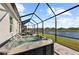 Relax in the screened-in patio with a hot tub and peaceful water view at 14238 59Th E Cir, Bradenton, FL 34211