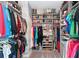 Spacious, well-organized walk-in closet with shelves and hanging storage at 14238 59Th E Cir, Bradenton, FL 34211