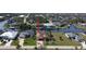 Beautiful waterfront property featuring lush landscaping and private boat dock at 15484 Alsask Cir, Port Charlotte, FL 33981