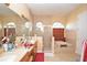 Bathroom features a tiled shower, soaking tub, and dual sinks, perfect for a relaxing spa-like experience at 15484 Alsask Cir, Port Charlotte, FL 33981