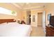 Bright and airy bedroom boasts a ceiling fan and large window offering ample natural light at 15484 Alsask Cir, Port Charlotte, FL 33981