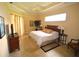 A peaceful bedroom featuring tile flooring, a ceiling fan, curtains, and a large window at 15484 Alsask Cir, Port Charlotte, FL 33981