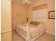 Quaint bedroom with a white bed and a window, perfect for rest at 15484 Alsask Cir, Port Charlotte, FL 33981