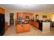 A well-equipped kitchen features stylish cabinets, granite countertops, and a central island for meal preparation at 15484 Alsask Cir, Port Charlotte, FL 33981