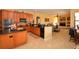 A chef-inspired kitchen with modern appliances, granite countertops, and ample storage space in a lovely home at 15484 Alsask Cir, Port Charlotte, FL 33981
