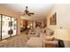 Comfortable living room with a large sectional sofa and views into kitchen at 15484 Alsask Cir, Port Charlotte, FL 33981