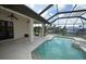 Relaxing screened in pool area with a water view and a covered patio at 15484 Alsask Cir, Port Charlotte, FL 33981