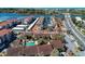 Scenic aerial view of a coastal community with pool, harbor access, and vibrant cityscape backdrop at 1618 Stickney Point Rd # 101, Sarasota, FL 34231