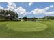 Scenic view of the lush green golf course, perfect for a relaxing day of golf at 1669 Monarch Dr # 201, Venice, FL 34293