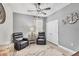 This bedroom features a neutral color scheme and stylish ceiling fan at 17739 Cantarina Cv, Bradenton, FL 34211