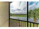 Enclosed balcony with seating and stunning views of the water and golf course, offering relaxation at 18008 Gawthrop Dr # 308, Bradenton, FL 34211
