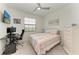 Bedroom featuring a desk, computer, and a bed next to a window, offering a versatile layout at 18008 Gawthrop Dr # 308, Bradenton, FL 34211