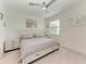 Comfortable bedroom with queen bed, side tables, and a window with blinds at 18008 Gawthrop Dr # 308, Bradenton, FL 34211