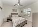 Cozy bedroom featuring a comfortable bed, ceiling fan, and a bright window, offering a relaxing space at 18008 Gawthrop Dr # 308, Bradenton, FL 34211