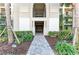 Inviting building entrance with manicured landscaping, showcasing the walkway leading to the entryway at 18008 Gawthrop Dr # 308, Bradenton, FL 34211