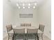Minimalist dining room featuring a simple table set and stylish lighting, ideal for intimate meals at 18008 Gawthrop Dr # 308, Bradenton, FL 34211