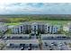 Exterior shot of a condominium with parking, golf course, and mature manicured landscaping in the background at 18008 Gawthrop Dr # 308, Bradenton, FL 34211