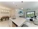 Open-concept kitchen with stainless steel appliances, quartz countertops and a dining and living room at 18008 Gawthrop Dr # 308, Bradenton, FL 34211