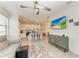 Bright living room with ceiling fan, modern decor and open concept to kitchen at 18008 Gawthrop Dr # 308, Bradenton, FL 34211