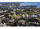 Beautiful aerial view of a waterfront community with manicured lawns and mature trees at 1838 Sandalwood Dr, Sarasota, FL 34231