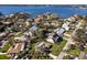 Gorgeous aerial view of a waterfront community with a swimming pool and mature trees at 1838 Sandalwood Dr, Sarasota, FL 34231