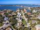 Lovely aerial view of a community with a waterfront and well-manicured lawns at 1838 Sandalwood Dr, Sarasota, FL 34231