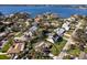 Aerial view of waterfront community featuring lush landscaping and mature trees surrounding each home at 1838 Sandalwood Dr, Sarasota, FL 34231