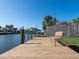 Dock with bench for relaxing and enjoying waterfront views at 1838 Sandalwood Dr, Sarasota, FL 34231
