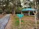 Crocker Trail Loop paved walking trail with a covered gazebo and sign at 1838 Sandalwood Dr, Sarasota, FL 34231