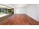 Bright and airy living room with hardwood floors and sliding doors that offer seamless access to the outdoors at 1838 Sandalwood Dr, Sarasota, FL 34231
