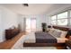 Main bedroom showcasing a sliding glass door to the backyard and modern furnishings at 1838 Sandalwood Dr, Sarasota, FL 34231