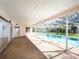 Covered patio with a wet bar and a beautiful view of the sparkling swimming pool at 1838 Sandalwood Dr, Sarasota, FL 34231