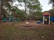 Community playground with slides, climbing structures, and ample space for to play at 1838 Sandalwood Dr, Sarasota, FL 34231