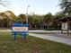 Welcome sign to Potter Park, with information booth, trees, and ample green space at 1838 Sandalwood Dr, Sarasota, FL 34231