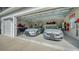 Spacious three car garage with ample storage for vehicles and equipment at 20 Bayhead Ln, Osprey, FL 34229