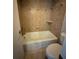 This cozy bathroom has tiled walls, a shower-tub combo, and modern fixtures, perfect for relaxing after a long day at 2105 Pueblo Cir # V2, Sarasota, FL 34231
