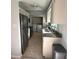 The kitchen features stainless steel appliances, granite countertops, and seamless access to the in-unit laundry area at 2105 Pueblo Cir # V2, Sarasota, FL 34231