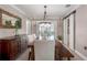 Beautiful dining room with a rustic table, seating and modern light fixture at 2211 51St W St, Bradenton, FL 34209