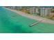 Beautiful aerial view of the beach, docks, and condo community at 2301 Gulf Of Mexico Dr # 33N, Longboat Key, FL 34228