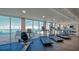 Bright gym with floor to ceiling windows, ocean views, treadmill, elliptical and stationary bike at 2301 Gulf Of Mexico Dr # 33N, Longboat Key, FL 34228