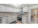 Modern kitchen with stainless steel stove and appliances at 2301 Gulf Of Mexico Dr # 33N, Longboat Key, FL 34228